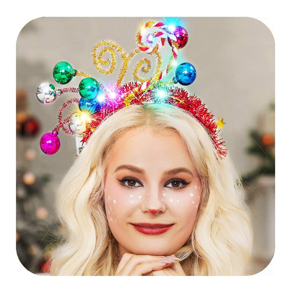 CAKURE Christmas headband with LED balls worn for festive glow and hands-free sparkle.