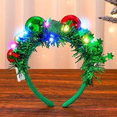 CAKURE LED Christmas headband with green glow for party-ready styling.
