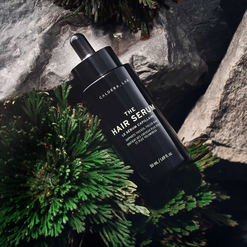 Caldera + Lab The Hair Serum drops application showing fast-absorbing formula.