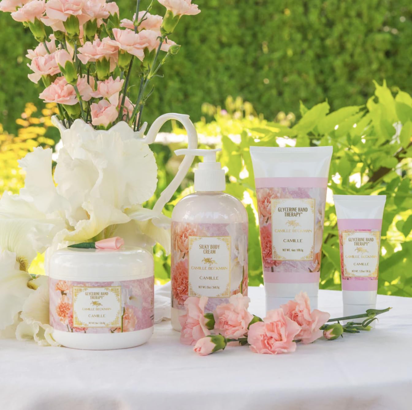 Camille Beckman hands application showcases everyday moisture and soft glow.