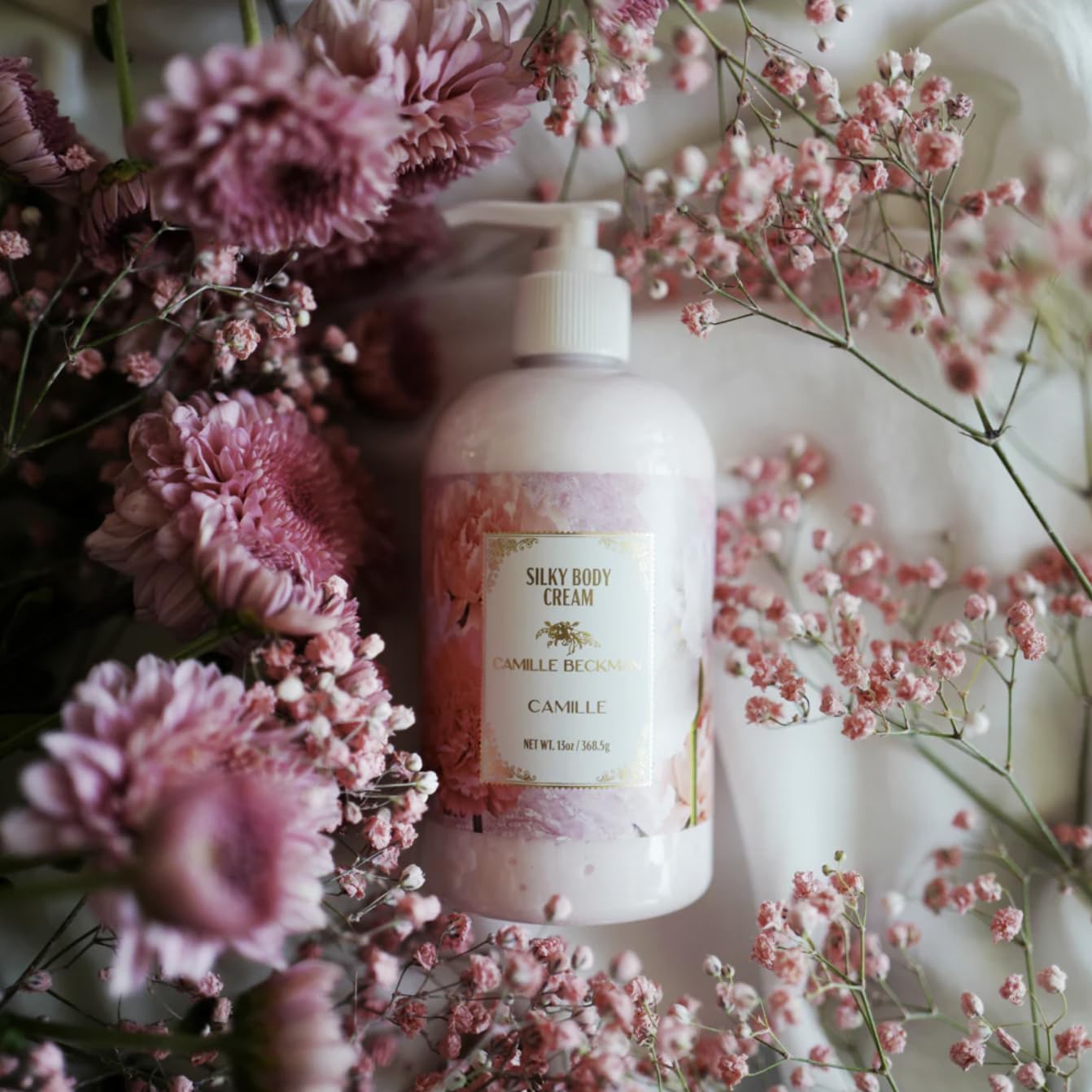 Camille Beckman label highlights almond oil, glycerin, and herbal extracts.