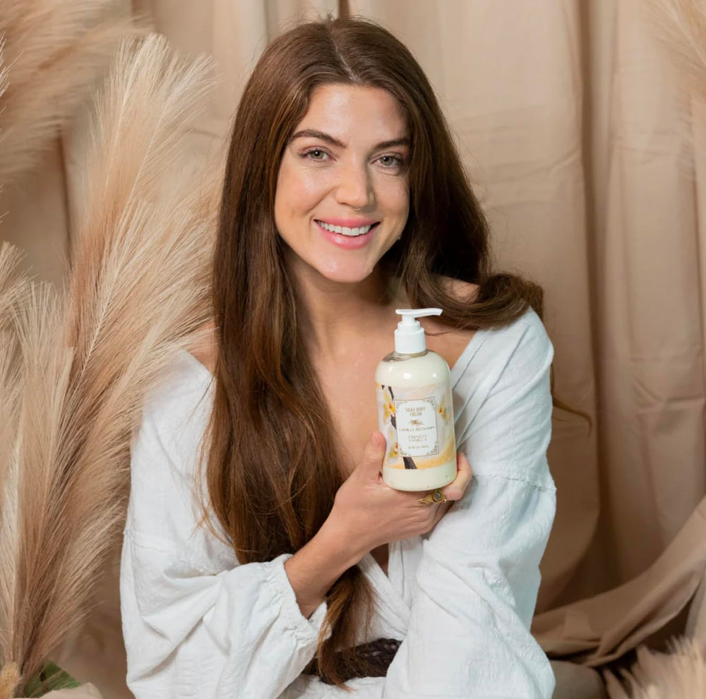Hands applying Camille Beckman cream for daily moisturization and smooth skin.