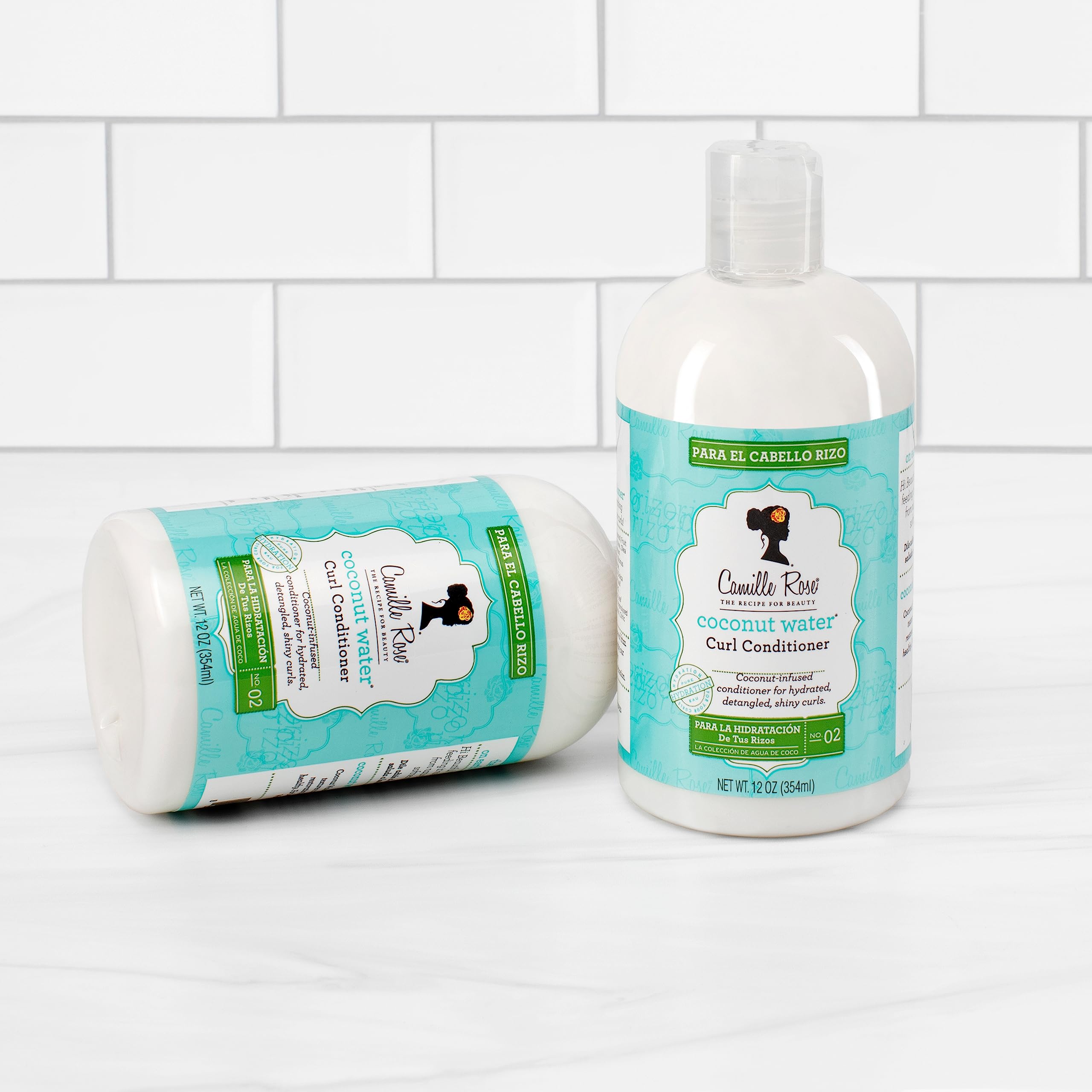 Rinsed curls reveal hydrated, bouncy hair after using Camille Rose Coconut Water Curl Conditioner.