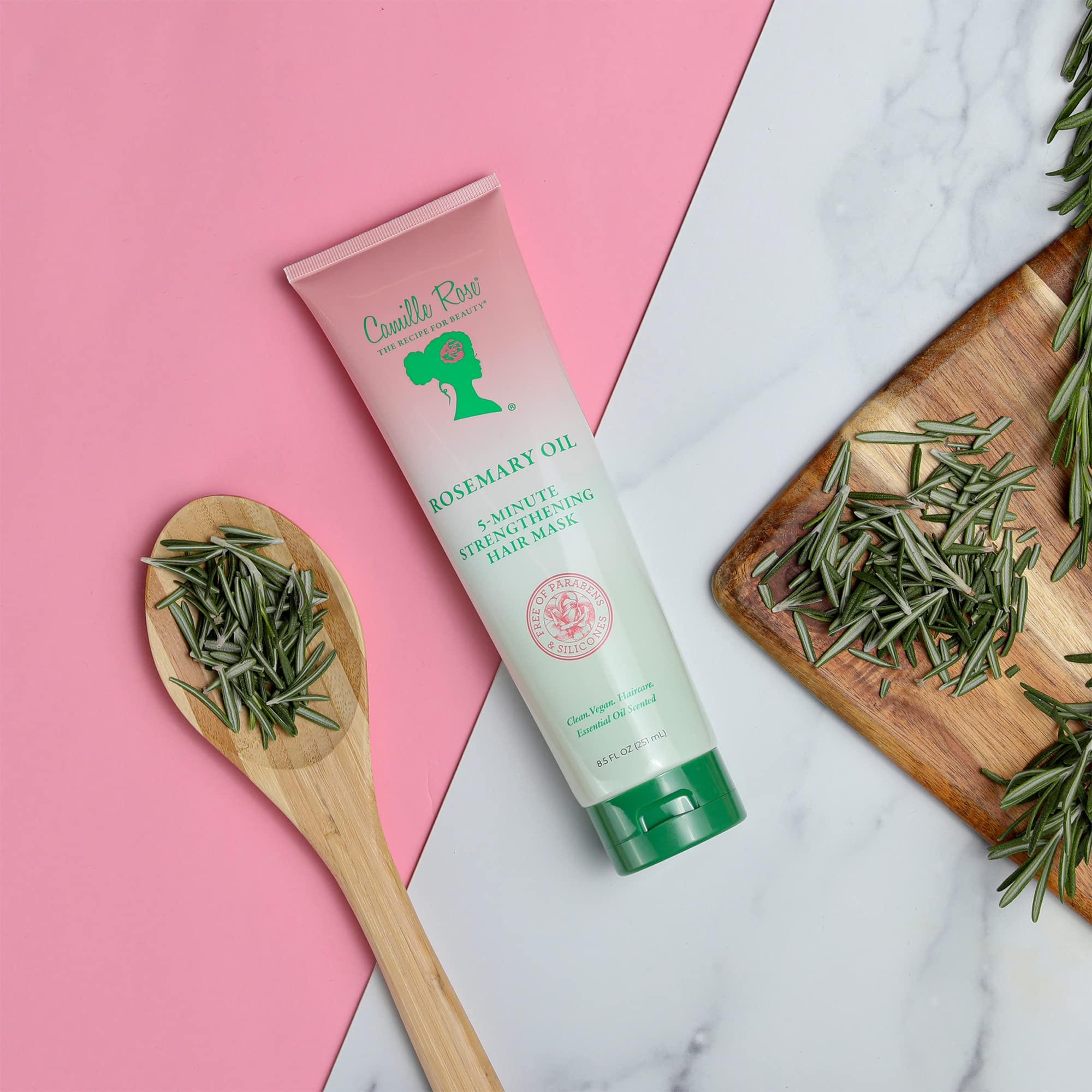 Camille Rose ingredient montage highlights rosemary, peppermint, and biotin for nourishing care
