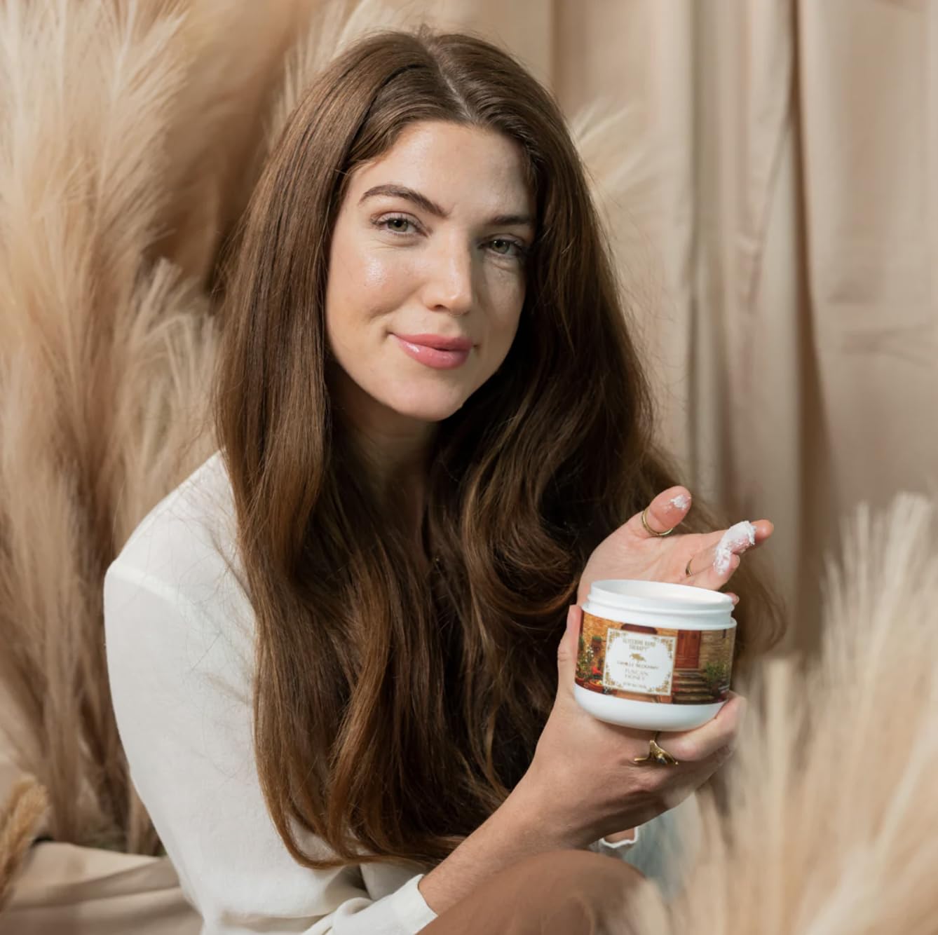 Camille Beckman hand therapy cream closeup shows creamy texture and glycerin-rich formula.