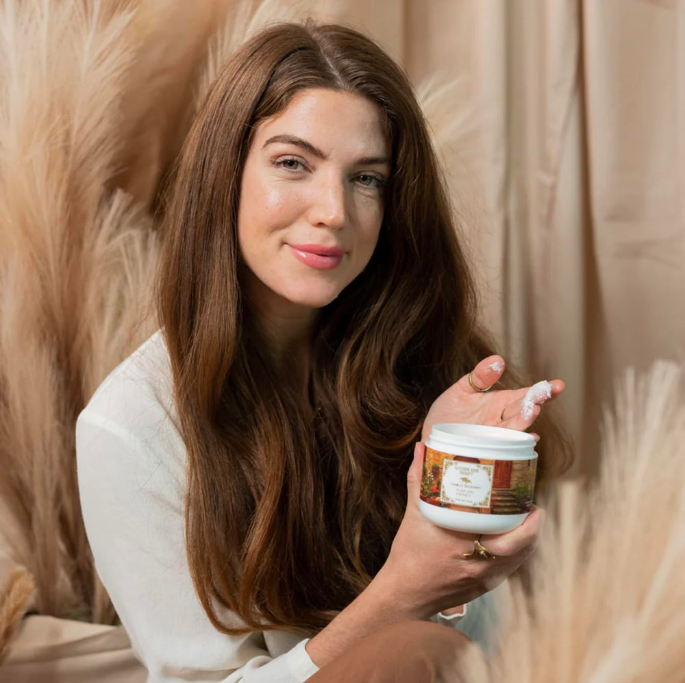 Camille Beckman hand therapy cream closeup shows creamy texture and glycerin-rich formula.