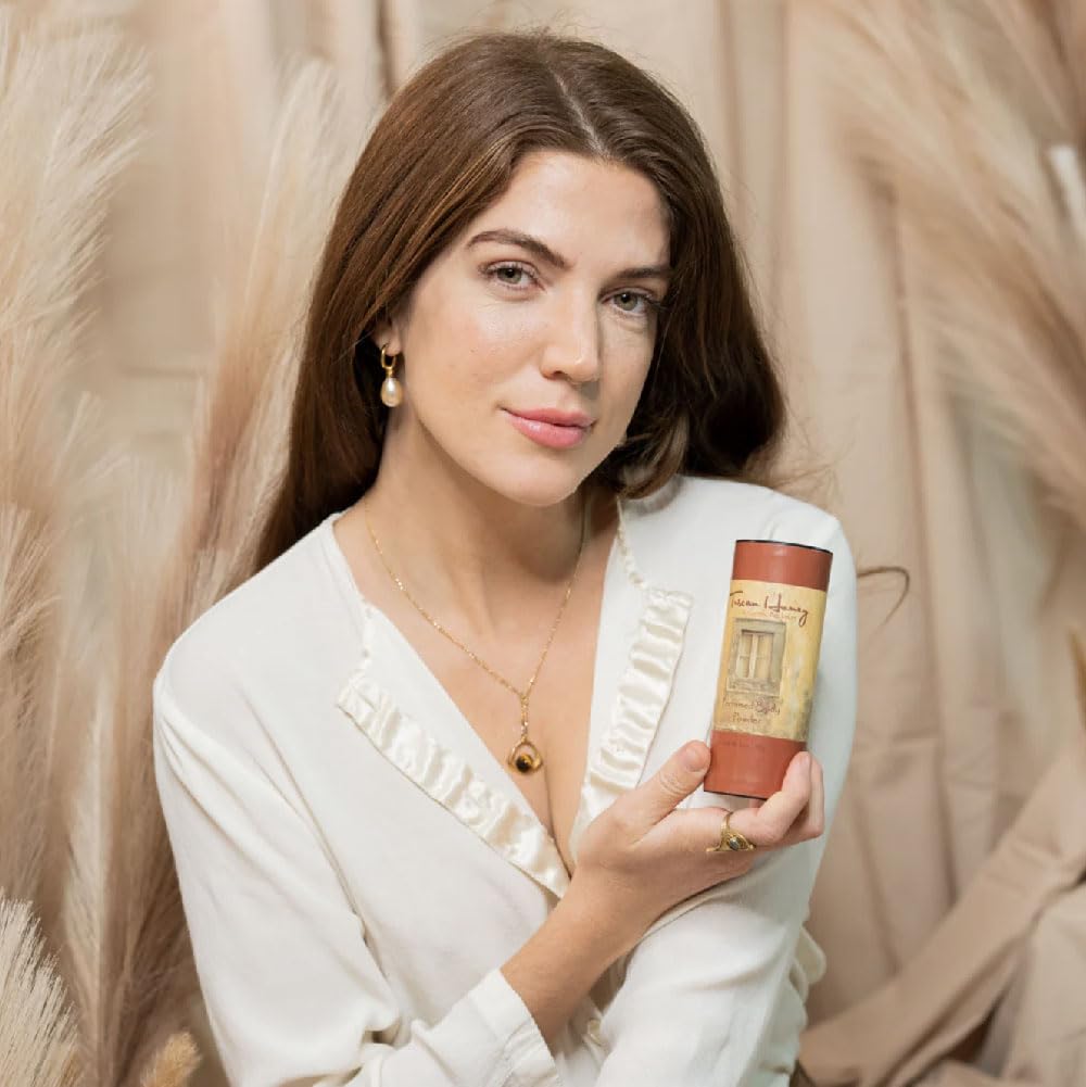 Camille Beckman Tuscan Honey application on hand demonstrates dusting action and fragrance release.