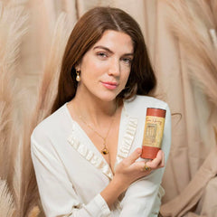 Camille Beckman Tuscan Honey application on hand demonstrates dusting action and fragrance release.