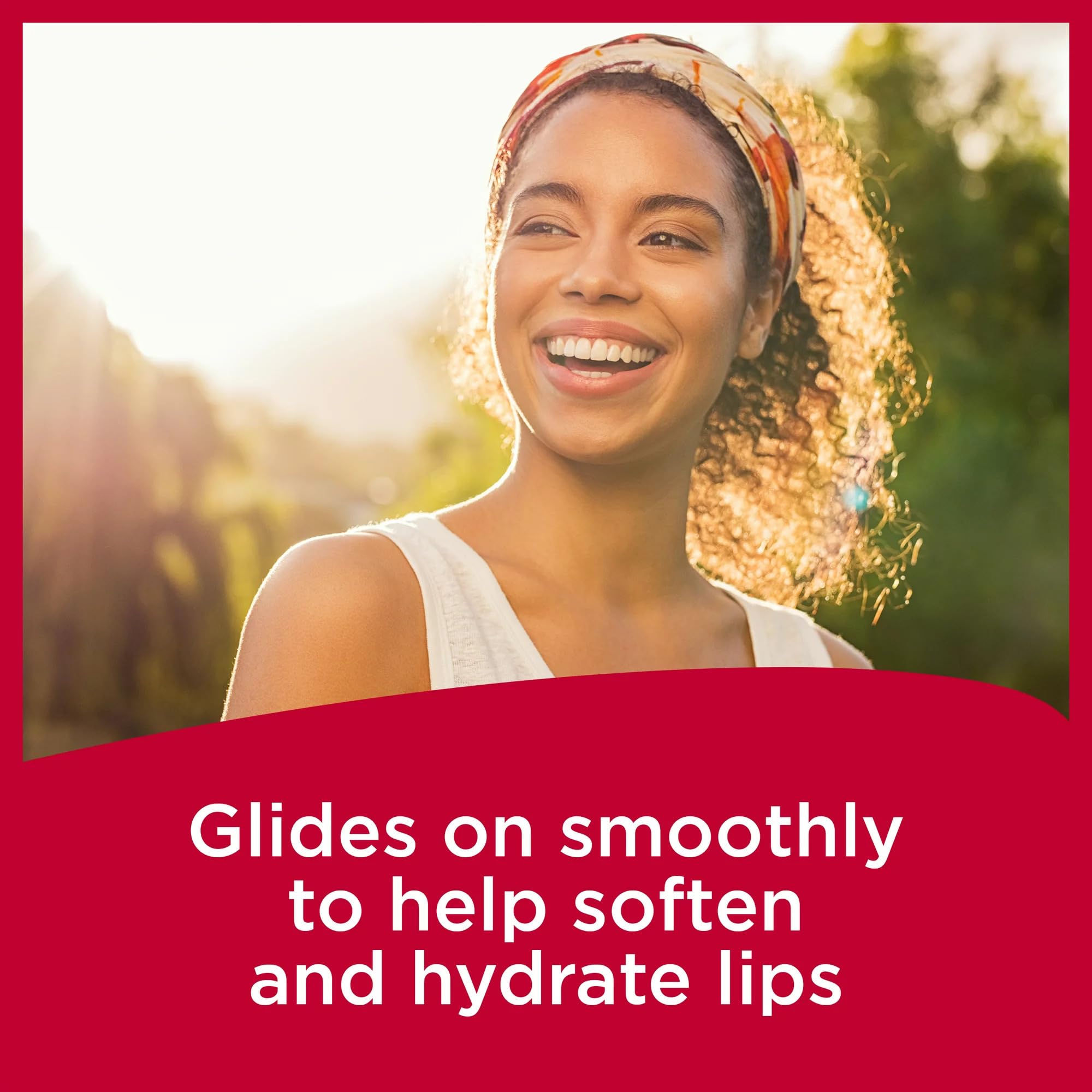 Carmex SPF15 application close-up on lips.