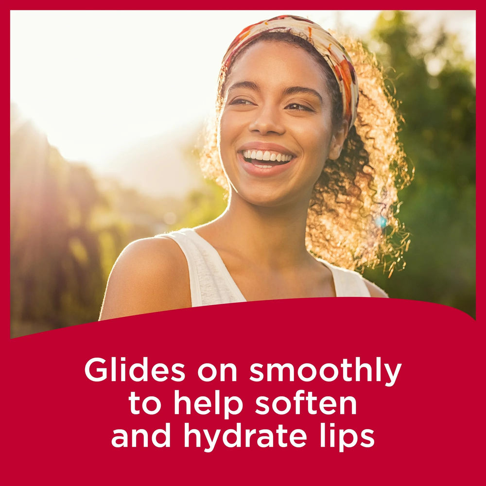 Carmex SPF15 application close-up on lips.