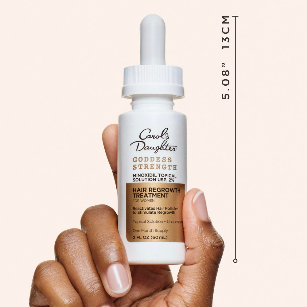 Lifestyle shot of woman integrating Goddess Strength into haircare routine.