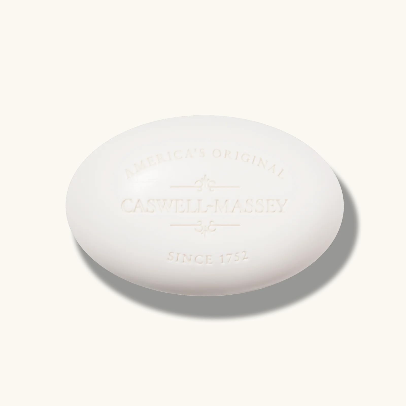 Caswell-Massey Almond Bar Soap user applying to skin during shower routine.