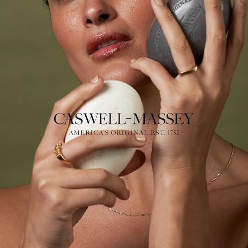 Caswell-Massey Lavender Bar Soap bar resting beside towels, ideal for daily cleansing.
