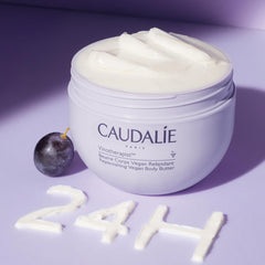 Caudalie body butter creamy texture ready for massage and daily nourishment.