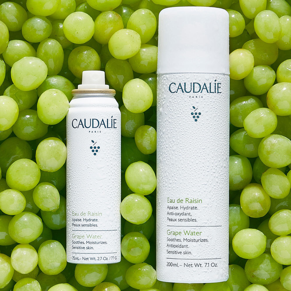 Caudalie mist closeup packaging, sleek 200 mL bottle on vanity.