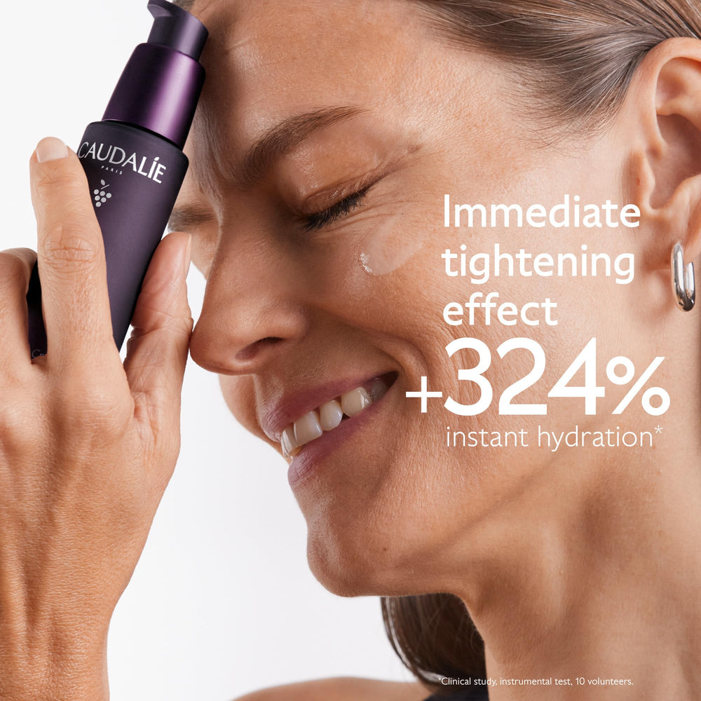 Caudalie Premier Cru serum application on face promotes smoother, refreshed skin.