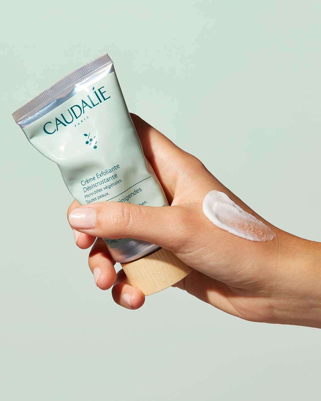 Caudalie Vinoclean exfoliator texture shows volcanic sand microbeads for gentle refinement.