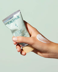 Caudalie Vinoclean exfoliator texture shows volcanic sand microbeads for gentle refinement.
