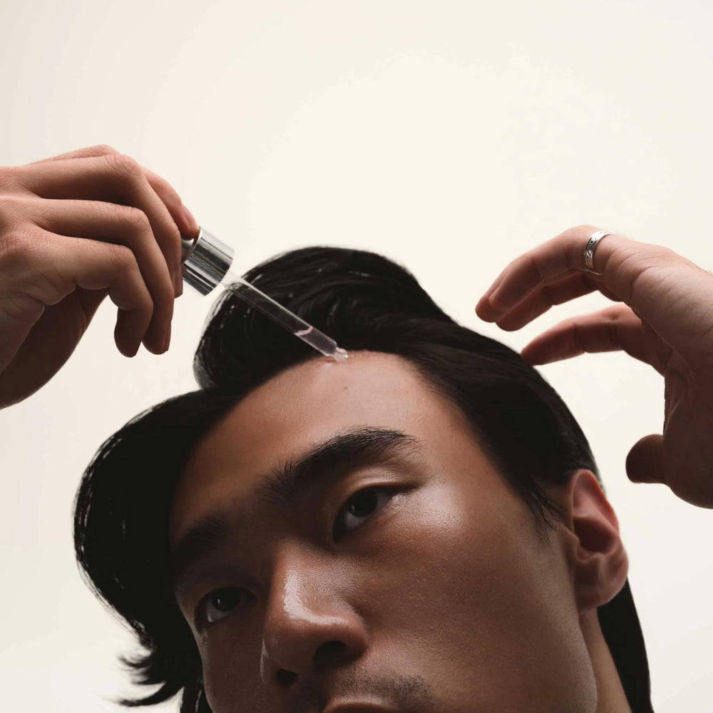 Cécred Extensions-ready hair serum being applied shows compatibility with wigs and extensions.