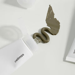 Celimax The Real Noni Refresh Clay Mask being applied to skin for pore-clearing clay action.