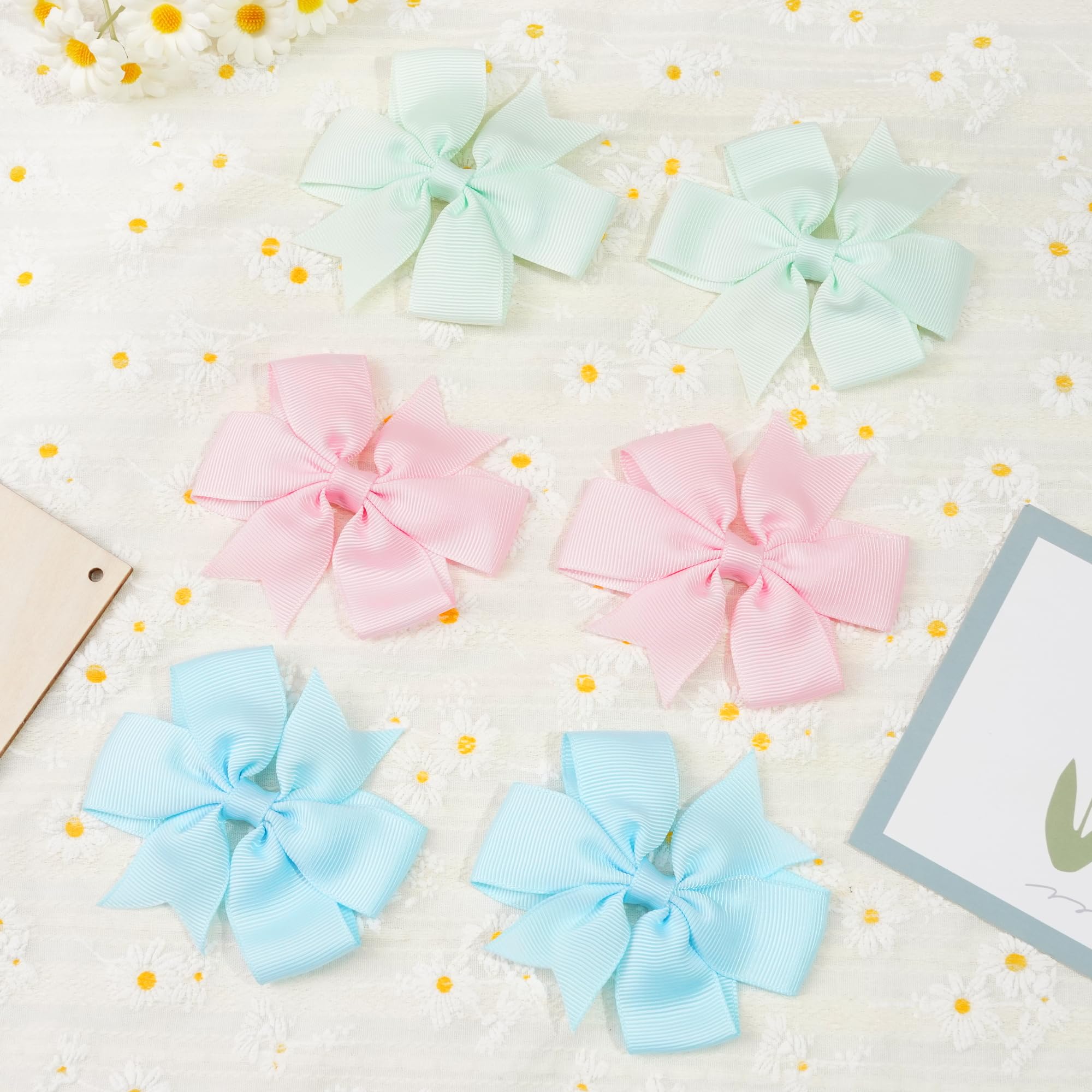 Celllot bows on girl's ponytail demonstrating easy wear and secure hold.