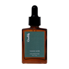 Chaddy Tanning Water on the face for a natural glow without sun exposure.
