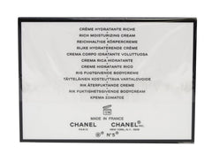 CHANEL N°5 body cream texture close-up emphasizes silky moisturizing feel.