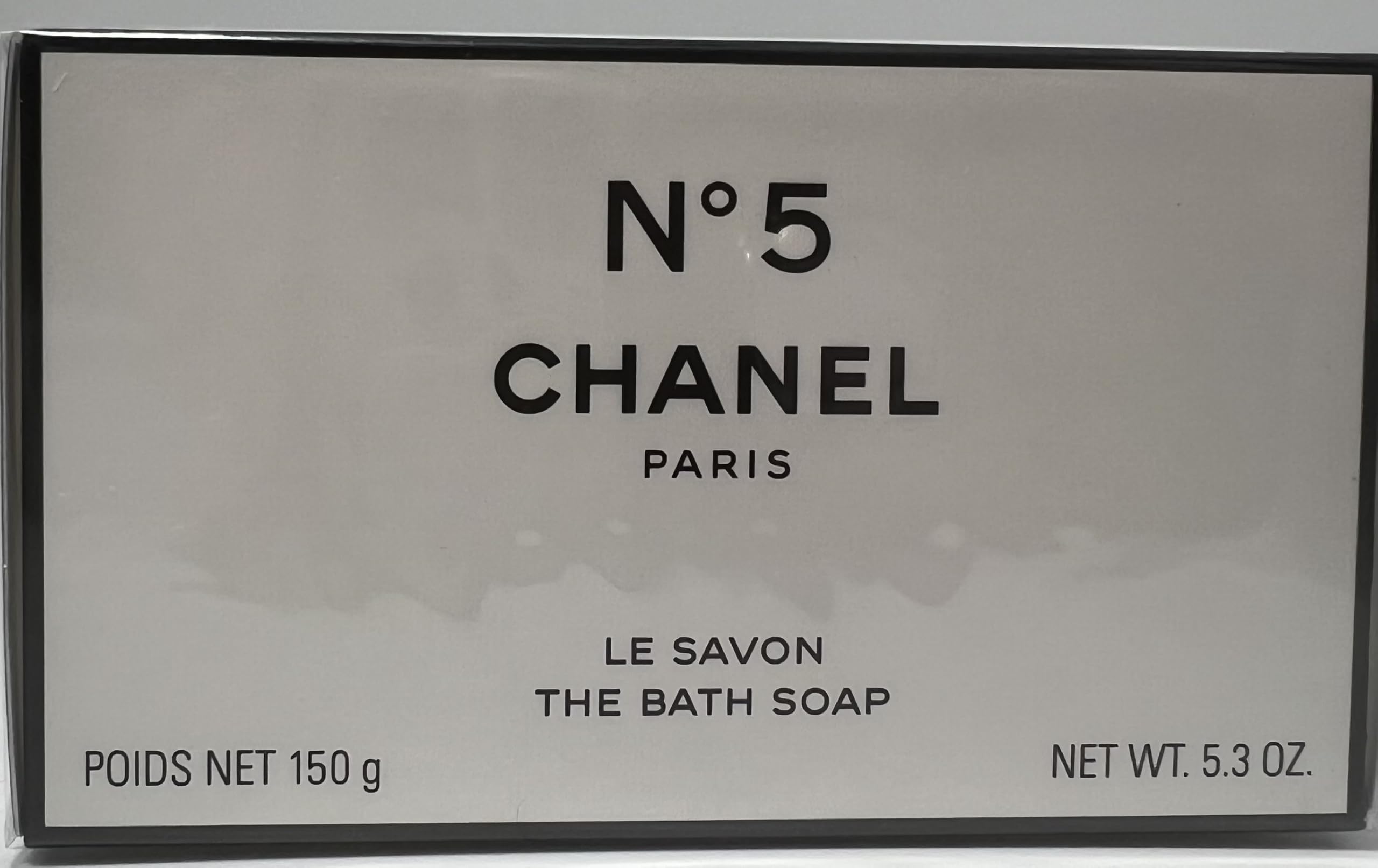 Chanel No 5 bath soap amber-patchouli mix close-up conveys warm, lasting fragrance.