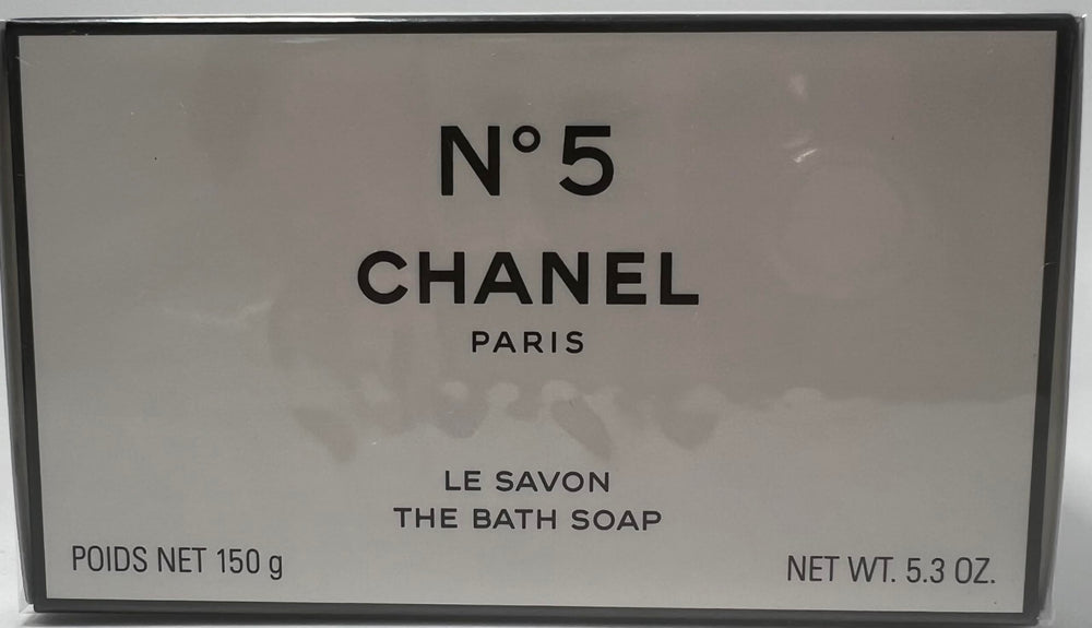 Chanel No 5 bath soap lather close-up reveals creamy foam for a pampering cleanse.