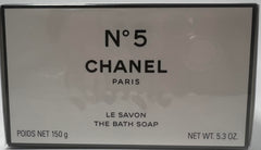 Chanel No 5 bath soap lather close-up reveals creamy foam for a pampering cleanse.