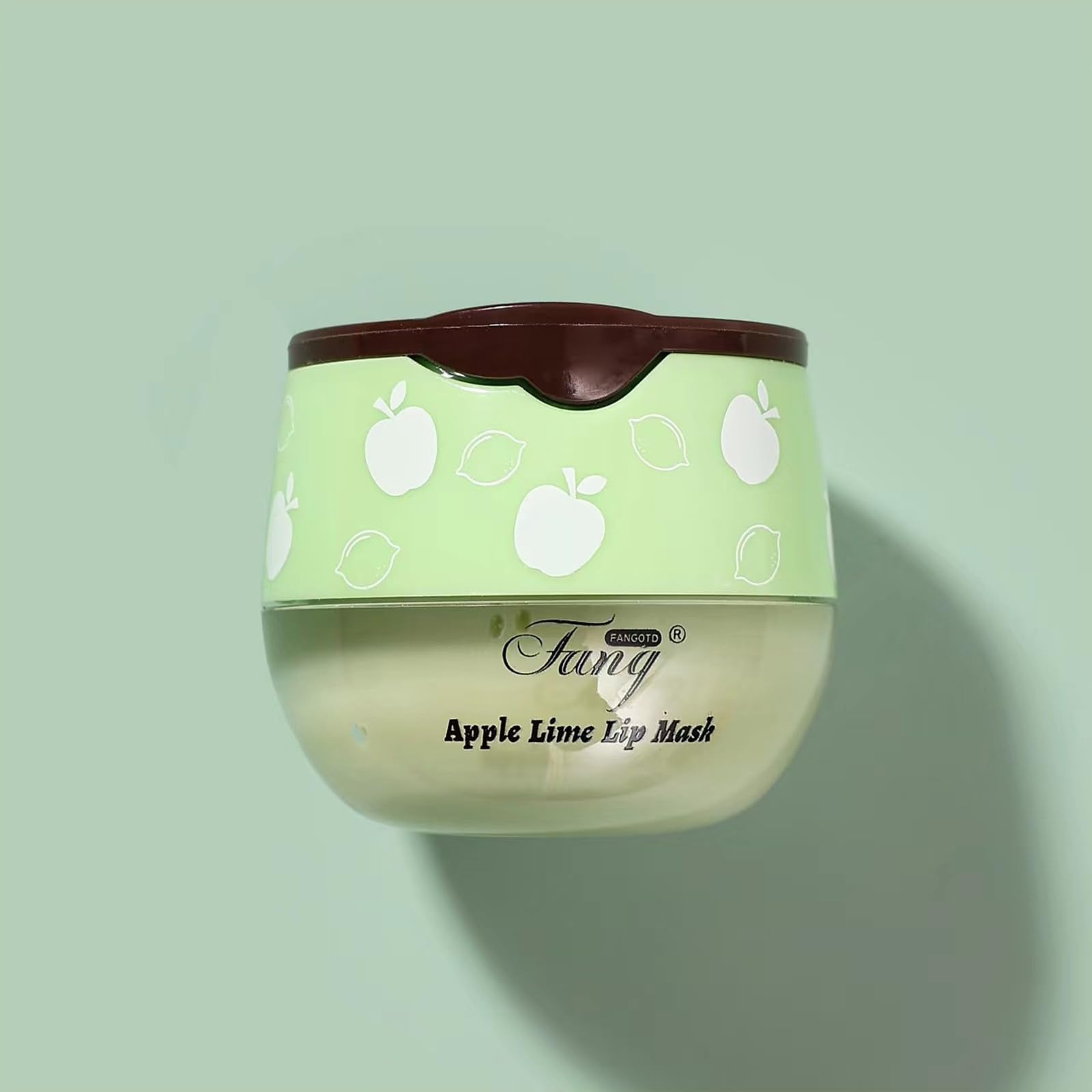 Charm Kiss honey-pot-packaging image emphasizes compact, gift-ready lip care.