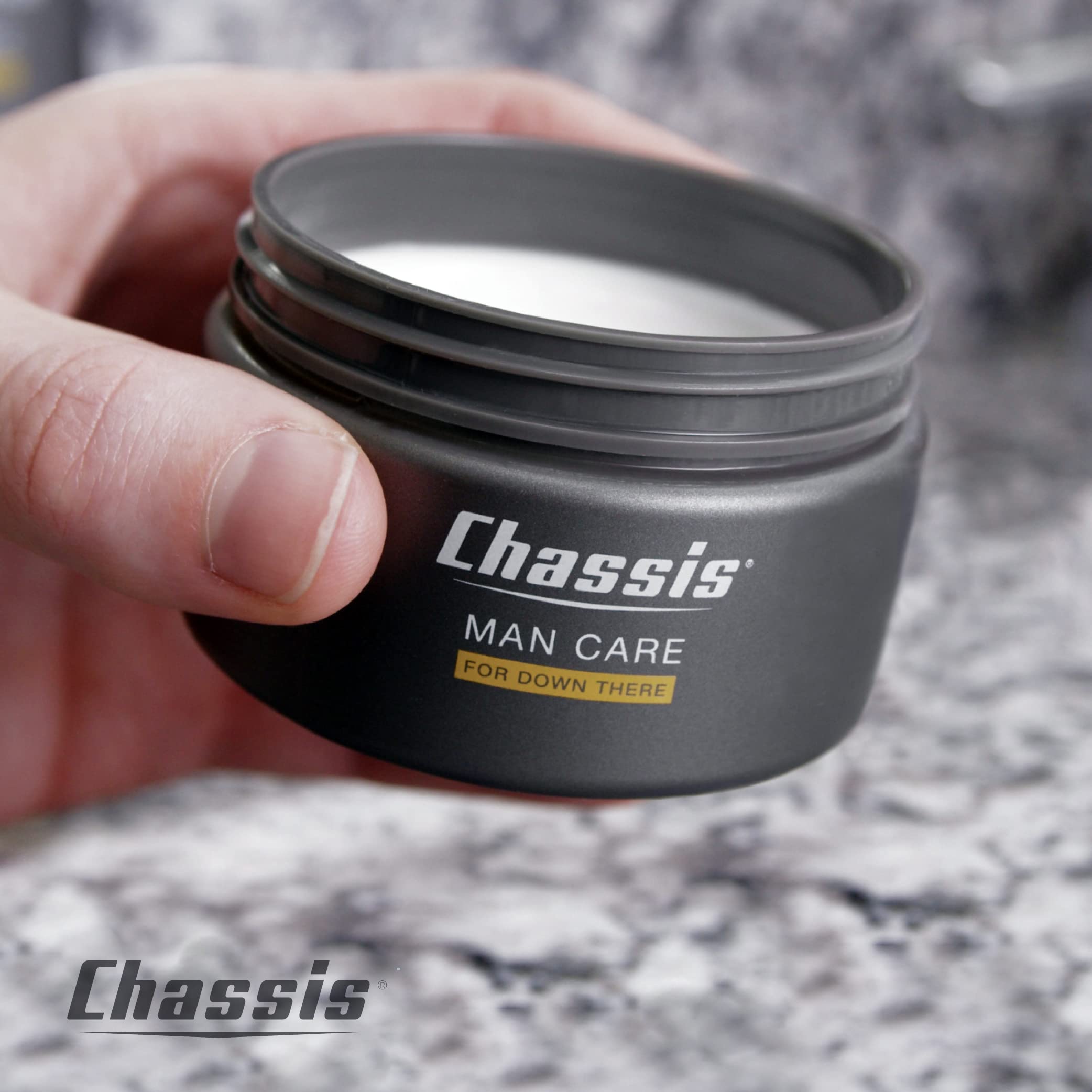 Chassis Restoration Cream on hands preparing for a workout