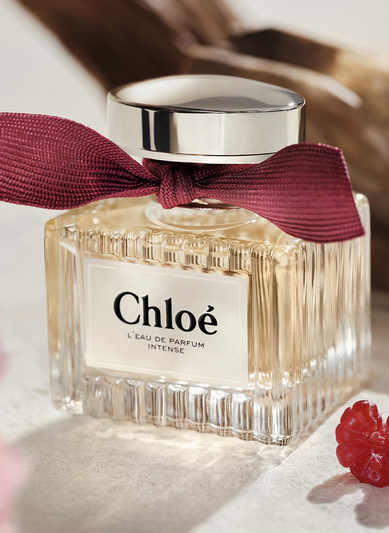 Chloé L'Eau de Parfum Intense rose close-up emphasizing romantic floral depth.