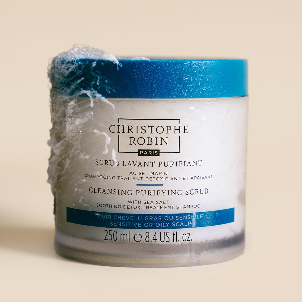 Christophe Robin cleansing-purifying-scrub bottle-pour showcases sea salt exfoliation for gentle scalp renewal