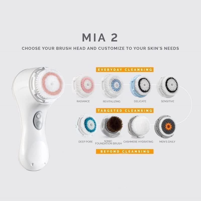 Clarisonic pink timer button highlights personalized cleansing with one-minute pulsing intervals.