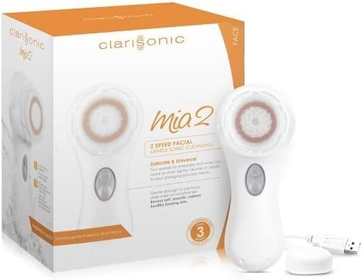Clarisonic pink cleansing system with cleanser bottle shows complete routine.