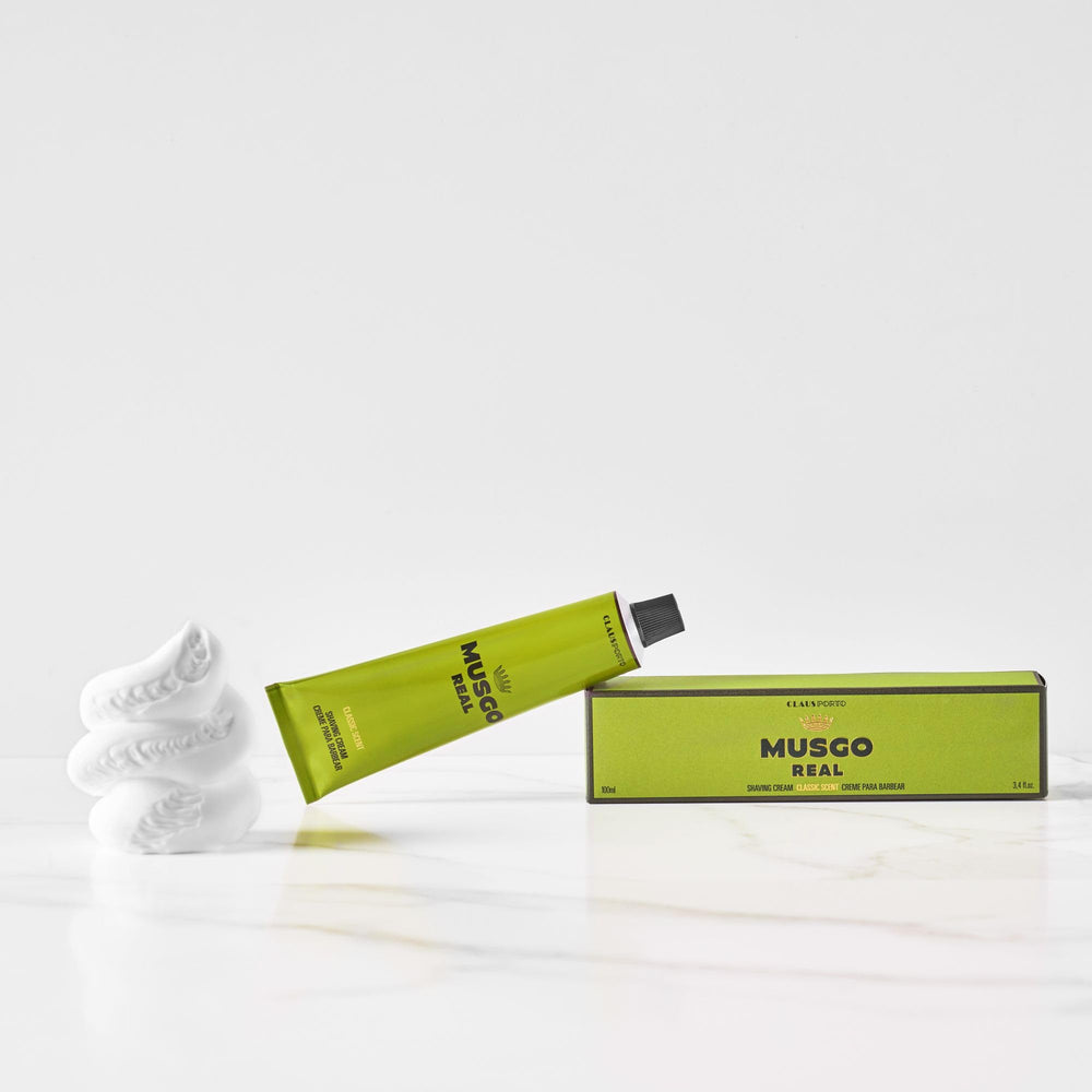 Claus Porto Musgo Real shaving cream being applied with a brush for rich coverage.