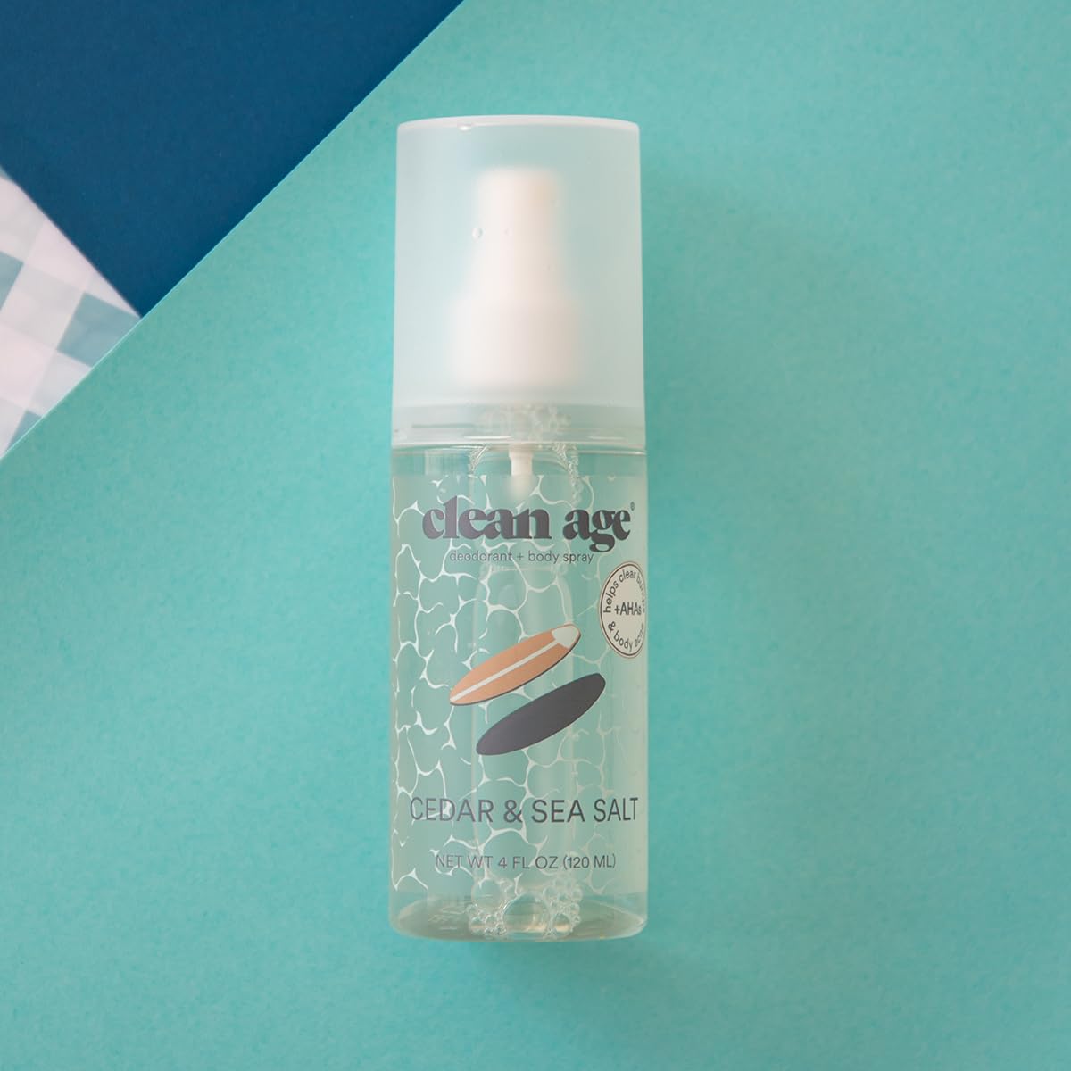 Clean Age Cedar body spray mist being sprayed for post-practice refresh.