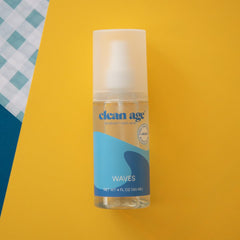 Clean Age Waves 4oz bottle pour demonstrates easy post-practice application.