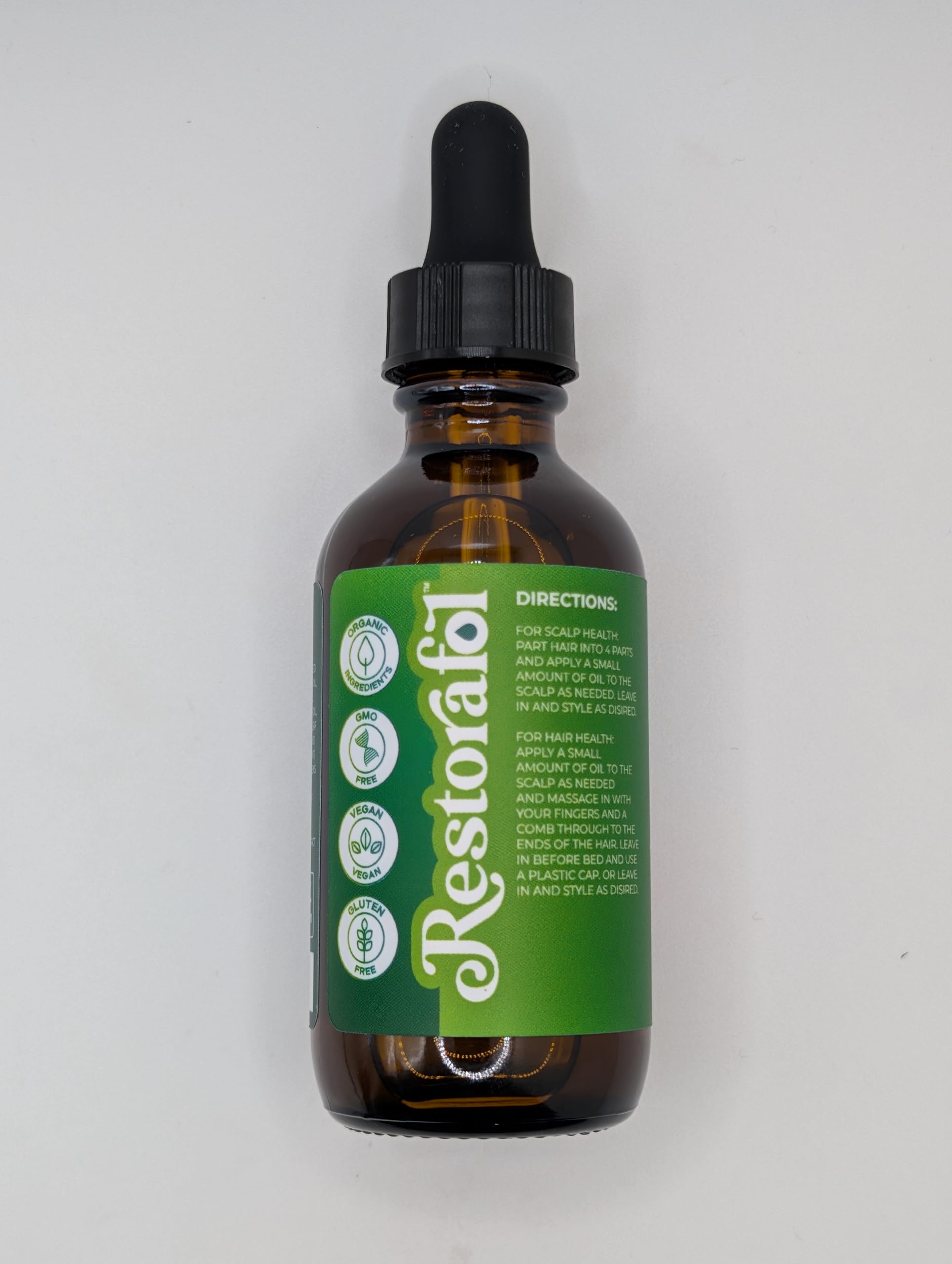 Clean Beauty Rosemary Hair Oil scalp massage scene implies relaxing routine.