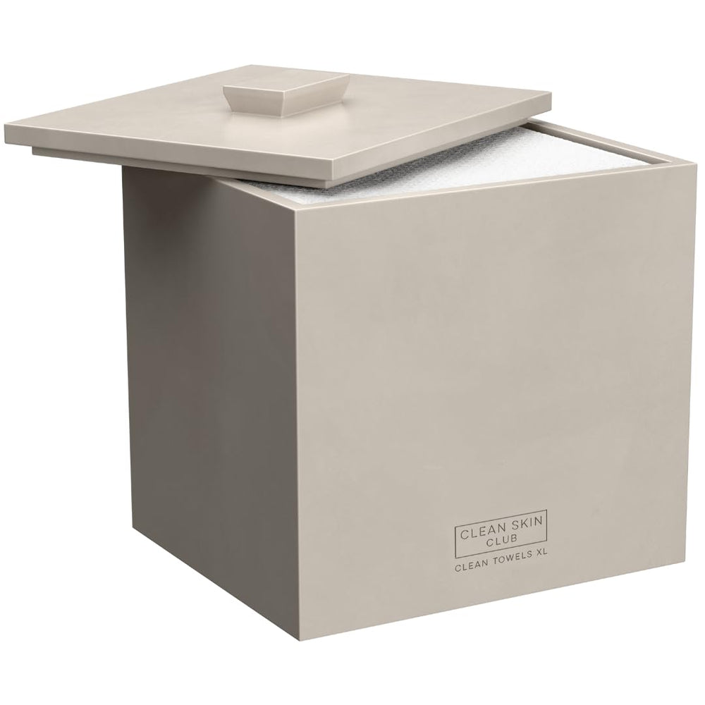 Clean Skin Club cement box front view showing neat towel storage on the counter.