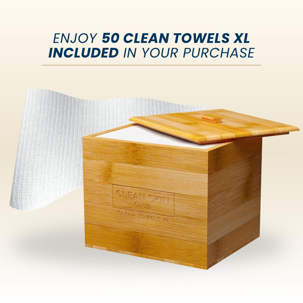 CLEAN SKIN CLUB Bathroom counter setup with tidy towel organization.