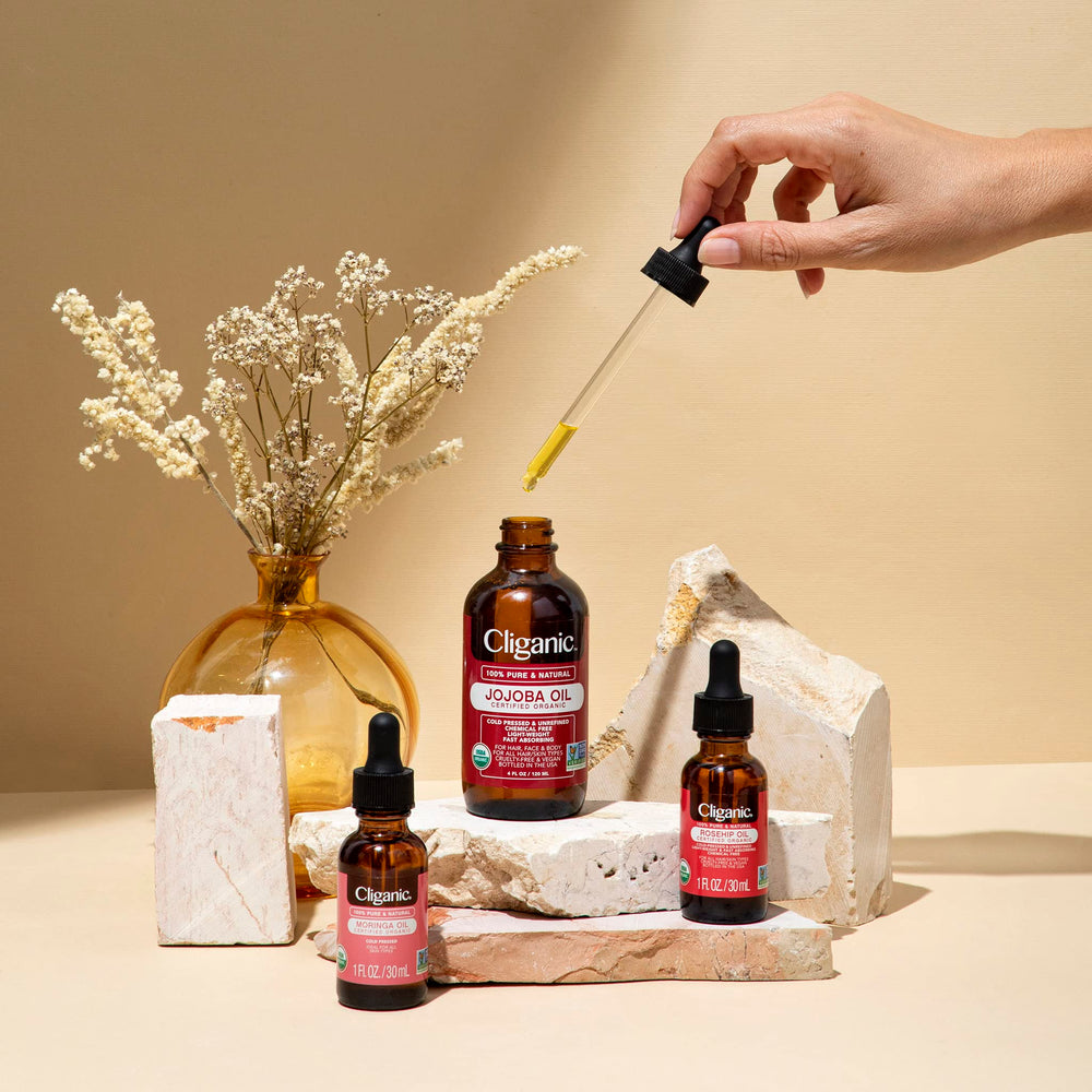 Cliganic marula oil skin-application image suggests smoothing and balancing hydration for complexion