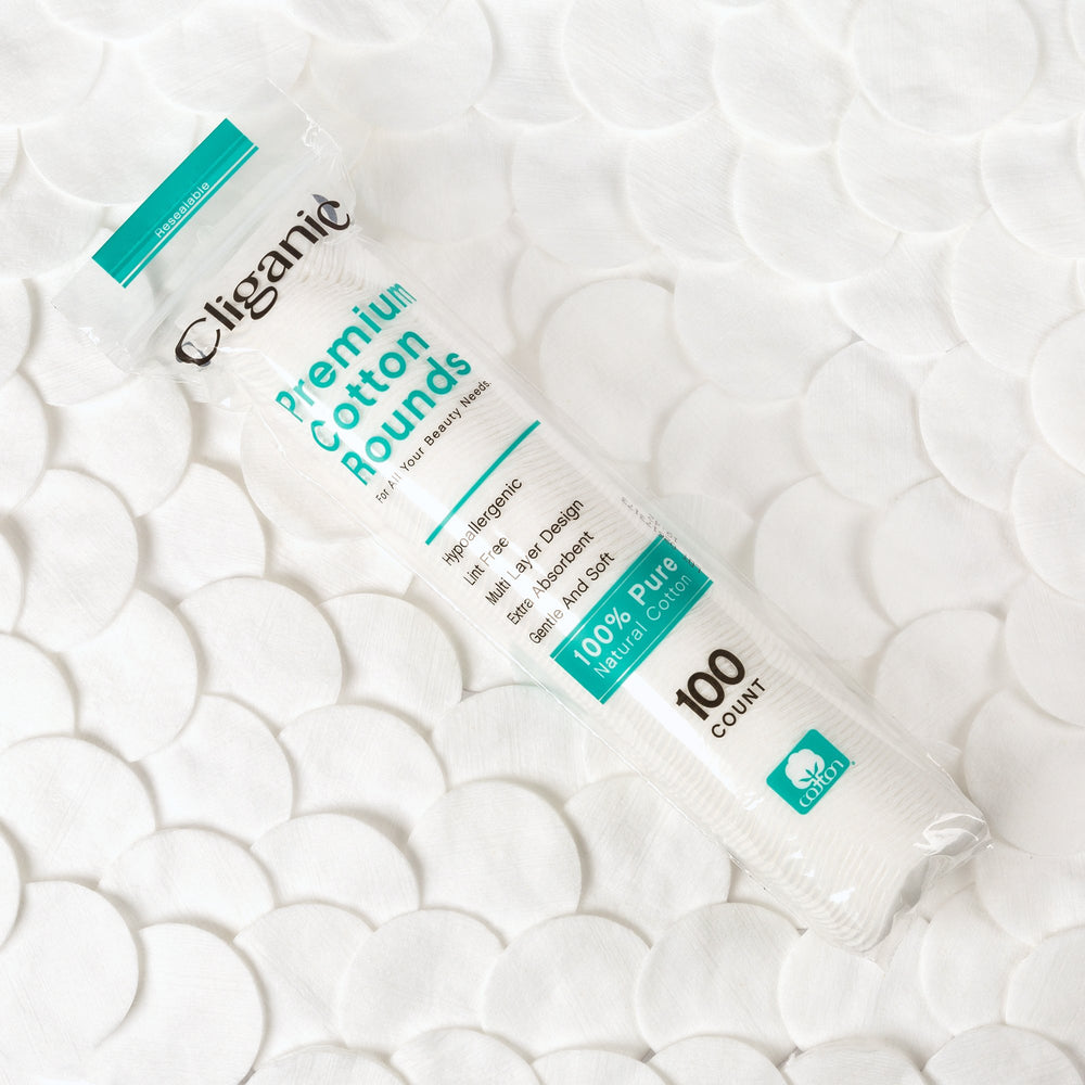Close-up of Cliganic Premium Cotton Rounds fibers, ultra-soft touch for sensitive skin.