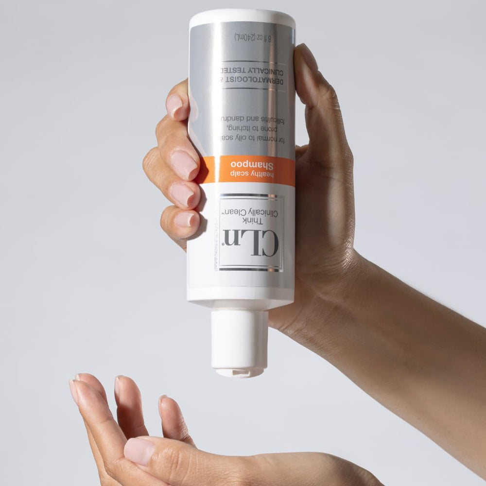 CLn Shampoo pump pouring into hand showing concentrated clarifying action at scalp