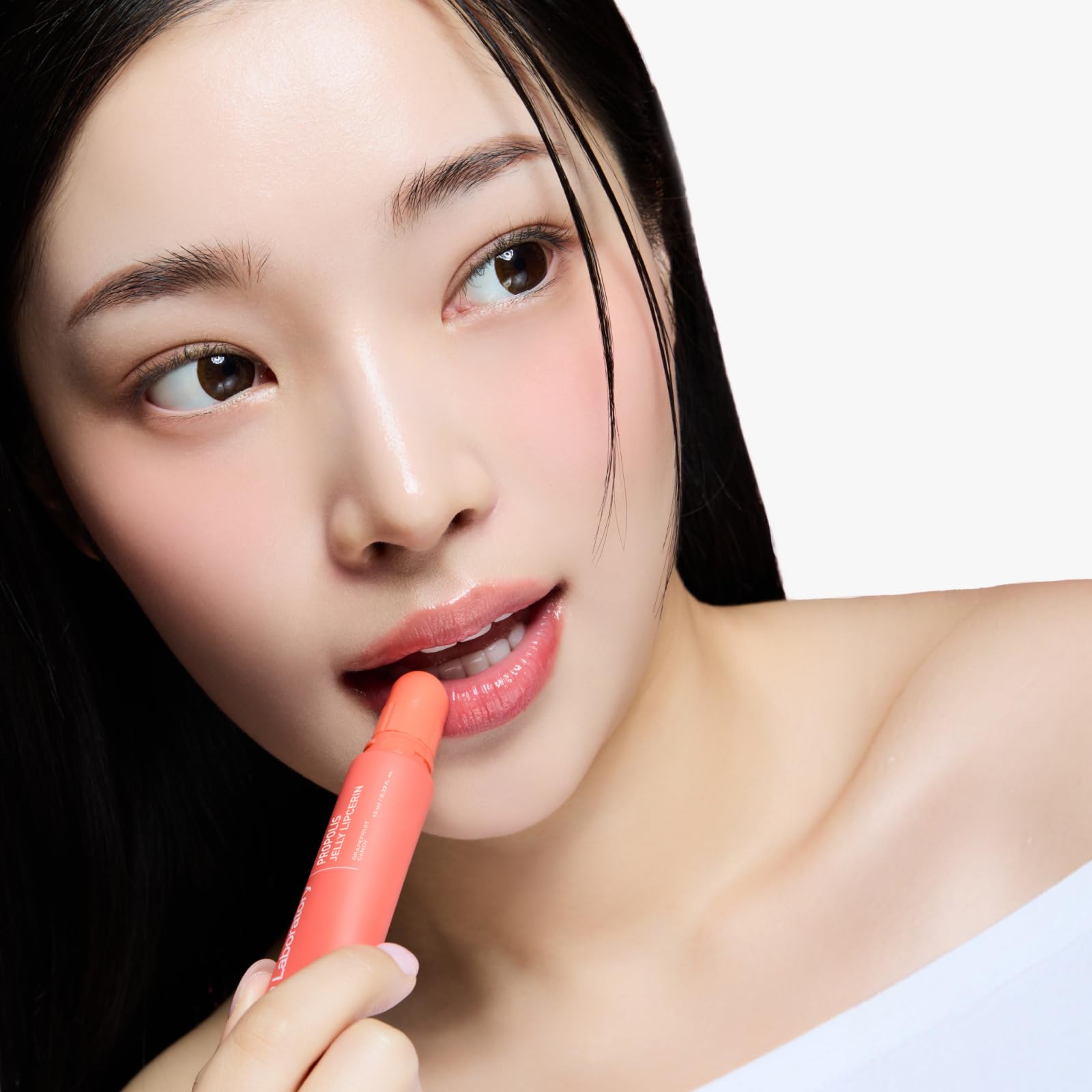 CNP Propolis Jelly Lipcerin Grapefruit Candy tint on lips for natural glow.