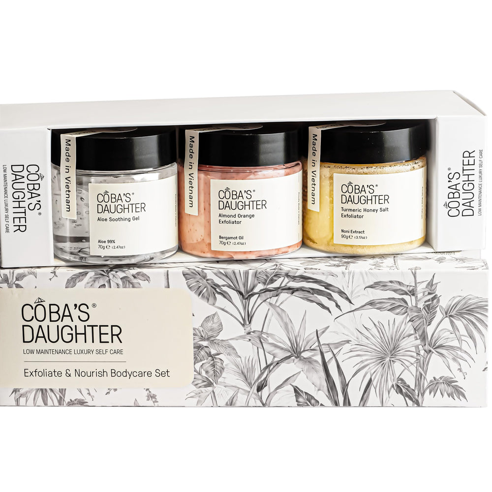 COBA'S DAUGHTER Honey Turmeric Scrub jar promotes radiant exfoliation for softer skin.