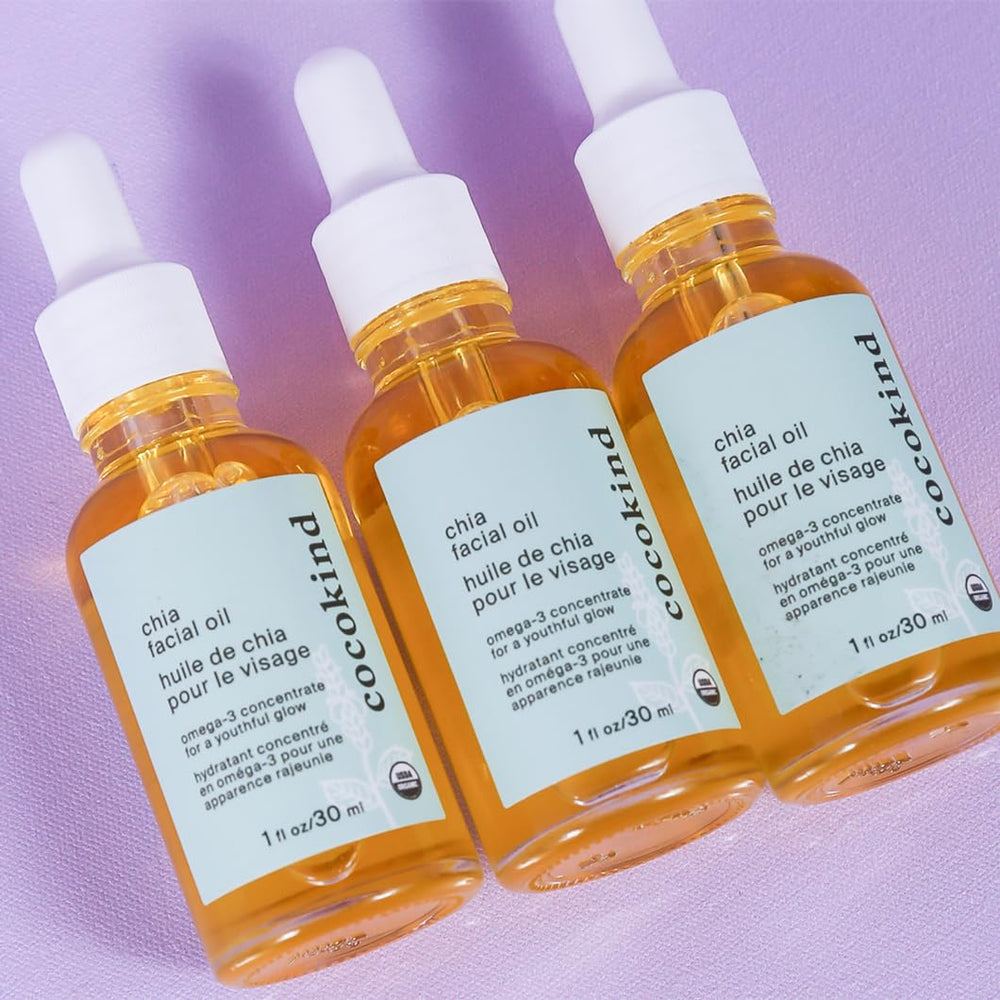 Cocokind Organic Chia Facial Oil being applied to skin for radiant moisture.