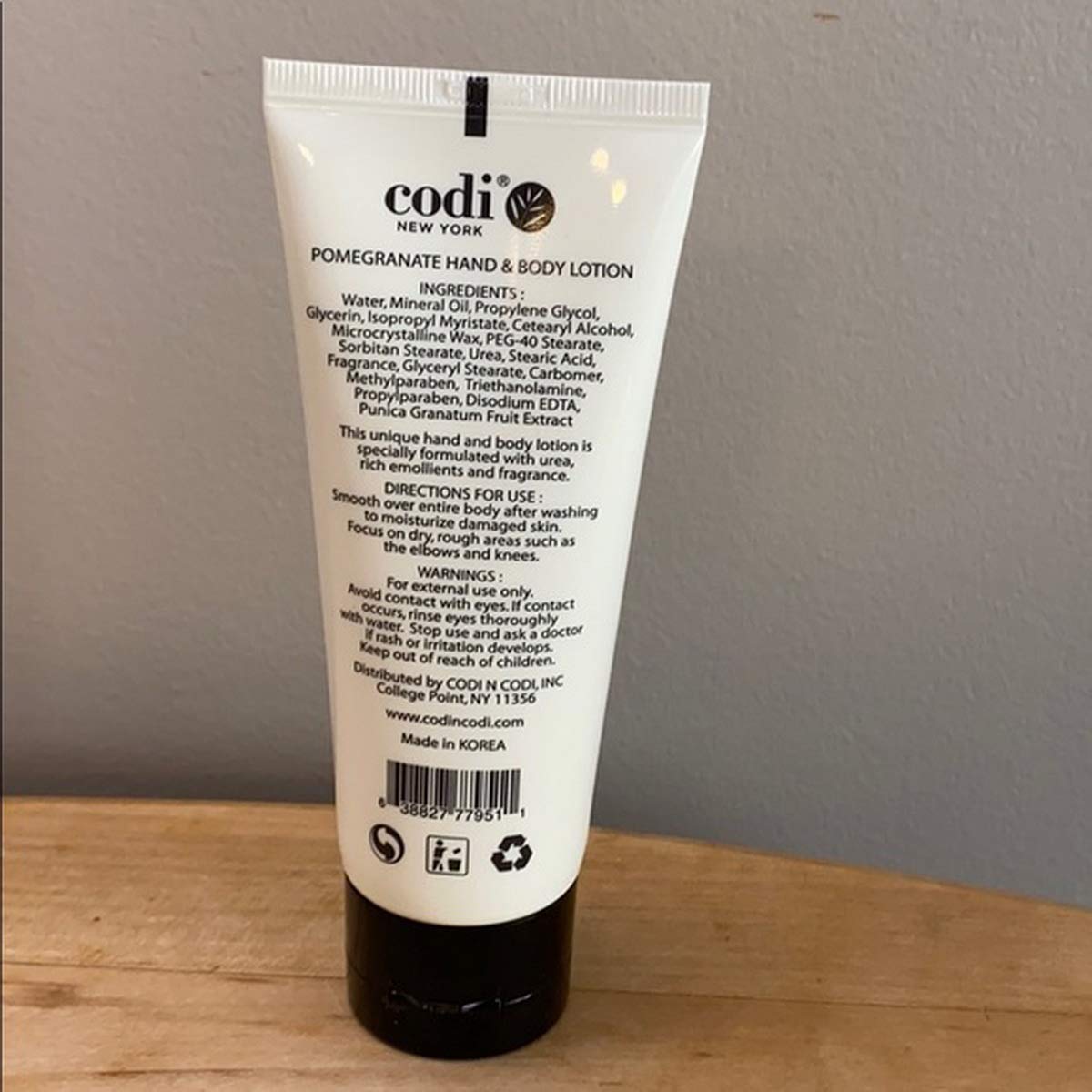 CODi Pomegranate Lotion texture closeup shows creamy, non-greasy consistency.
