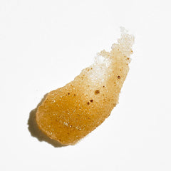 COLLEEN ROTHSCHILD Sugar Lip Scrub texture close-up shows fine sugar for soft lips.